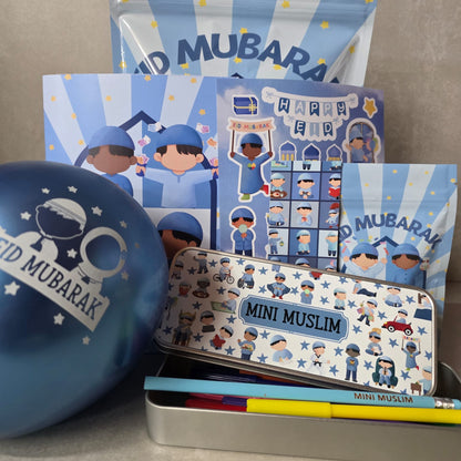 Collection of 'Mini Muslim' themed products including tins and cards with 'Mubarak' text.