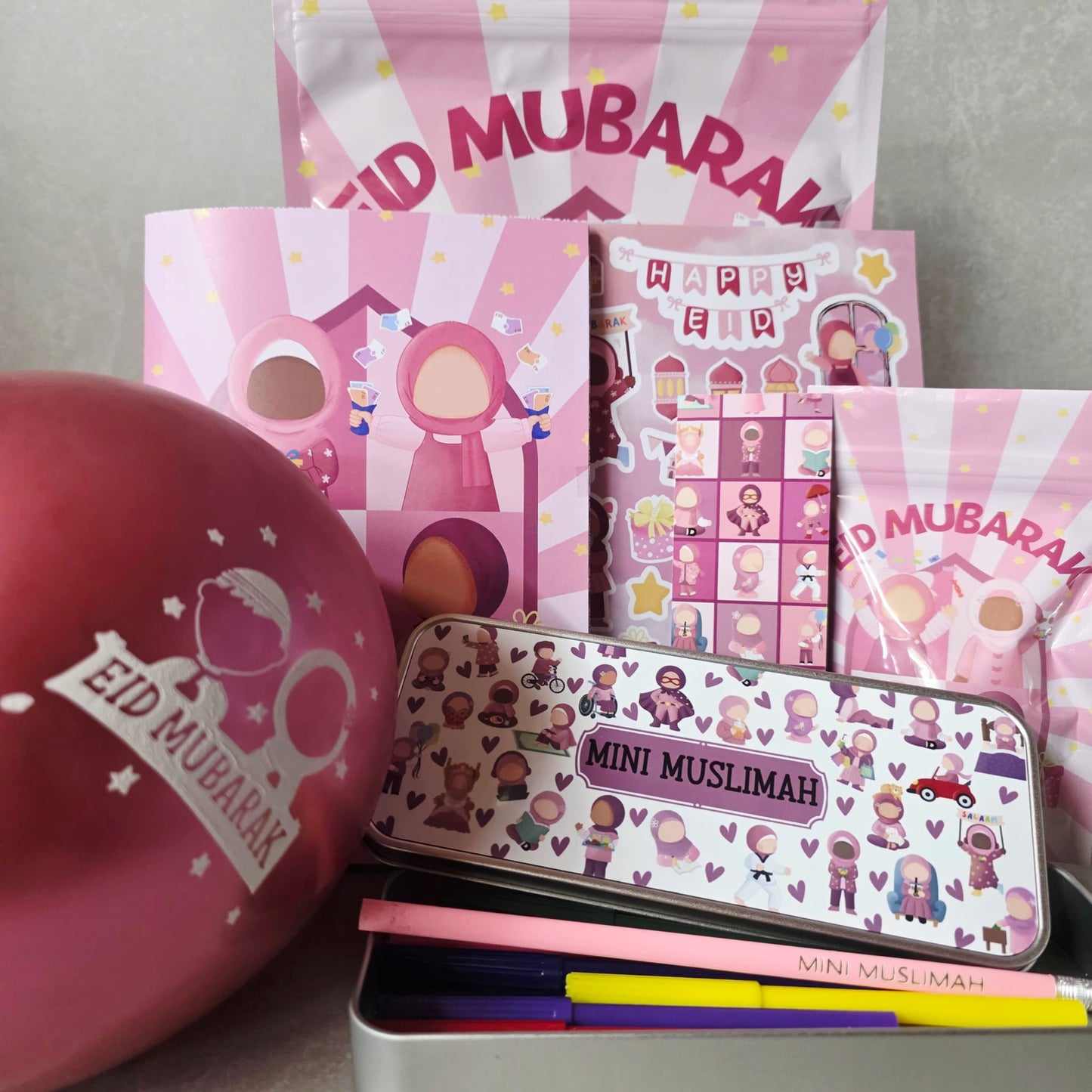 Pink 'Eid Mubarak' themed stationery set with a mini Muslimah tin and balloons.